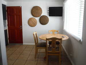 Dining space with tile patterned floors