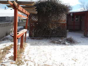 View of yard covered in snow