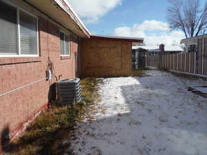 View of side of property with central AC unit