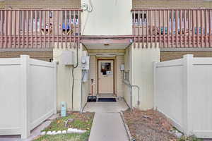 Property entrance featuring a balcony