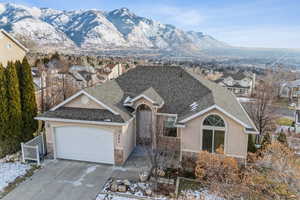 Ranch-style home featuring a mountain view and a garage