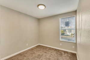 Spare room featuring carpet floors