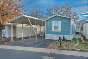 View of front of house featuring a carport