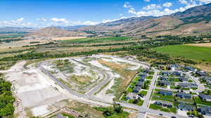 Birds eye view of property with a mountain view