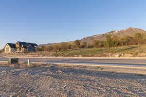 Exterior space with curbs and a mountain view
