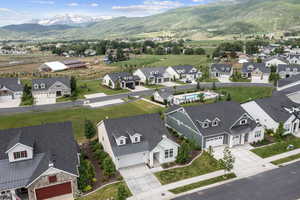 Drone / aerial view featuring a mountain view and a residential view