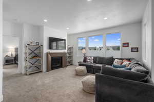 Carpeted living room featuring a textured ceiling