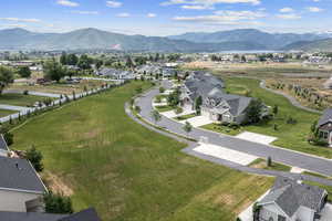 Birds eye view of property with a mountain view and a residential view