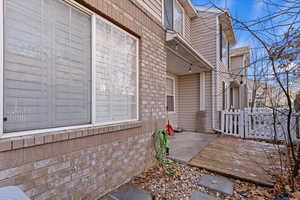 View of side of home featuring a deck