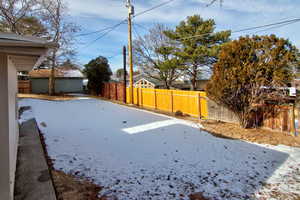 View of yard layered in snow