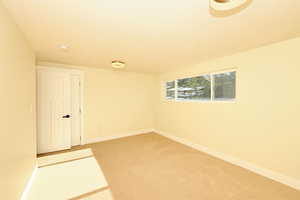 Empty room featuring carpet floors