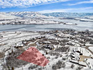 Snowy aerial view featuring a mountain view