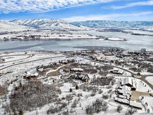 Snowy aerial view featuring a mountain view