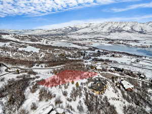 Snowy aerial view featuring a mountain view