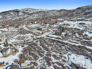 Snowy aerial view featuring a mountain view