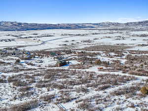 Snowy aerial view with a mountain view