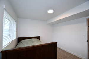 Unfurnished bedroom with carpet