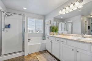 Bathroom with separate shower and tub and vanity