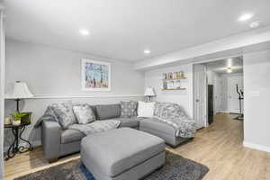 Basement featuring light wood-type flooring