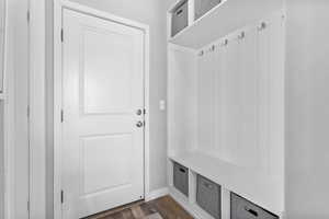 Mudroom with dark hardwood / wood-style flooring