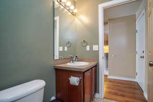 Bathroom featuring vanity and toilet