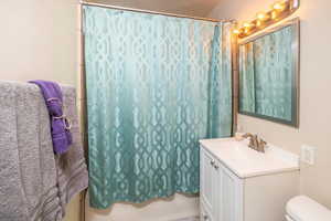 Bathroom with vanity and toilet