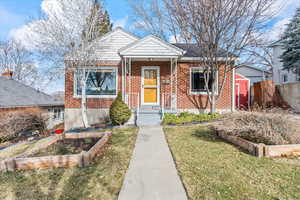 Bungalow with a front lawn