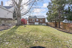 View of yard featuring a storage unit