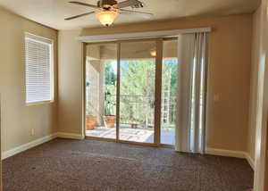 Entryway with carpet and ceiling fan