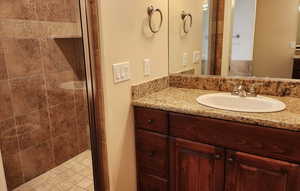 Bathroom with vanity and an enclosed shower