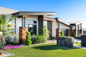 Modern home featuring a front yard