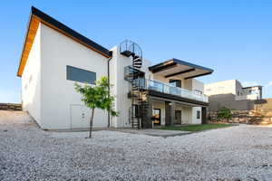 Rear view of property featuring a patio