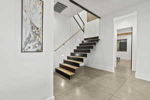 Stairway with concrete flooring