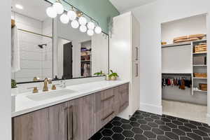 Bathroom with tile patterned flooring and vanity