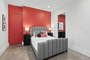 Bedroom featuring concrete flooring