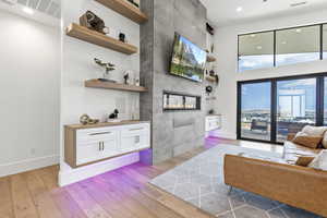 Living room featuring a fireplace and light hardwood / wood-style flooring