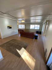 Unfurnished living room featuring light wood-type flooring