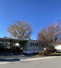 View of front of property with a carport