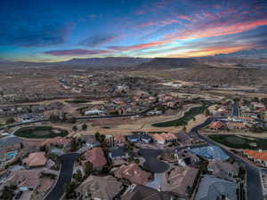 Aerial view at dusk featuring a mountain view