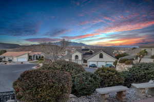 View of front facade with a garage and a mountain view