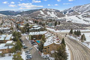 Snowy aerial view featuring a mountain view