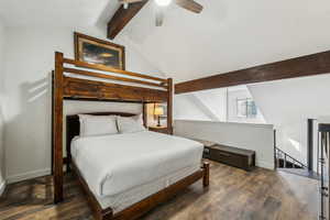 Bedroom with vaulted ceiling with beams, ceiling fan, and dark hardwood / wood-style floors