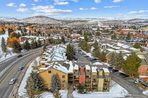 Snowy aerial view featuring a mountain view