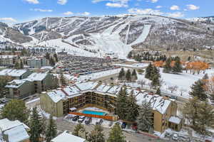 Snowy aerial view featuring a mountain view