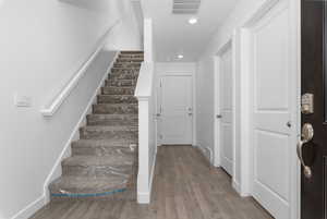 Staircase with wood-type flooring