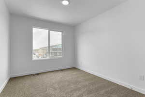 Unfurnished room with carpet flooring