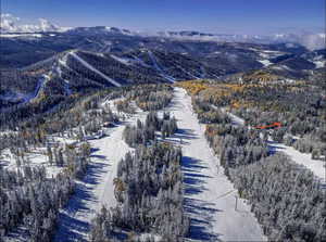 Snowy aerial view with a mountain view