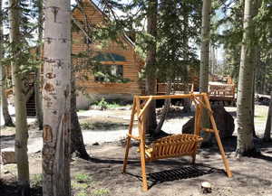 View of playground with a wooden deck