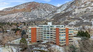 Snow covered property featuring a mountain view