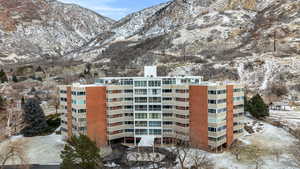 Snow covered building featuring a mountain view